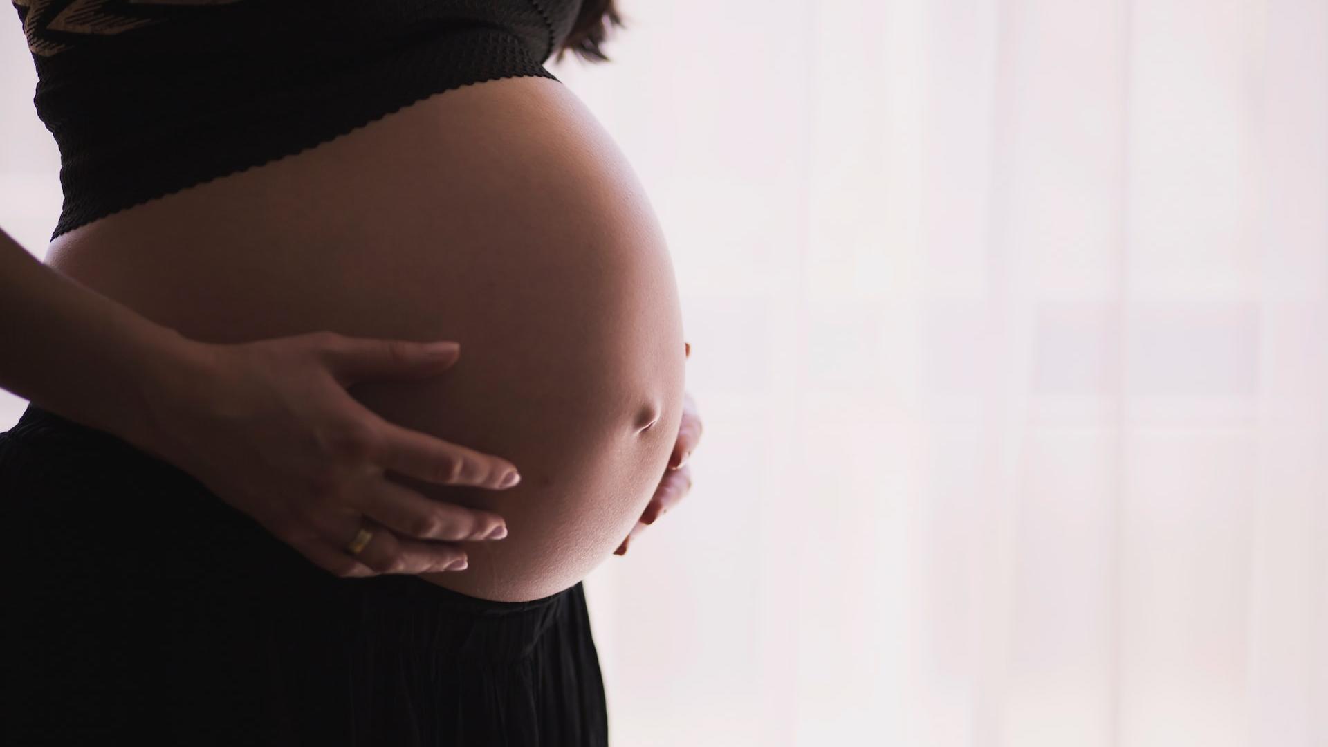 woman holding stomach